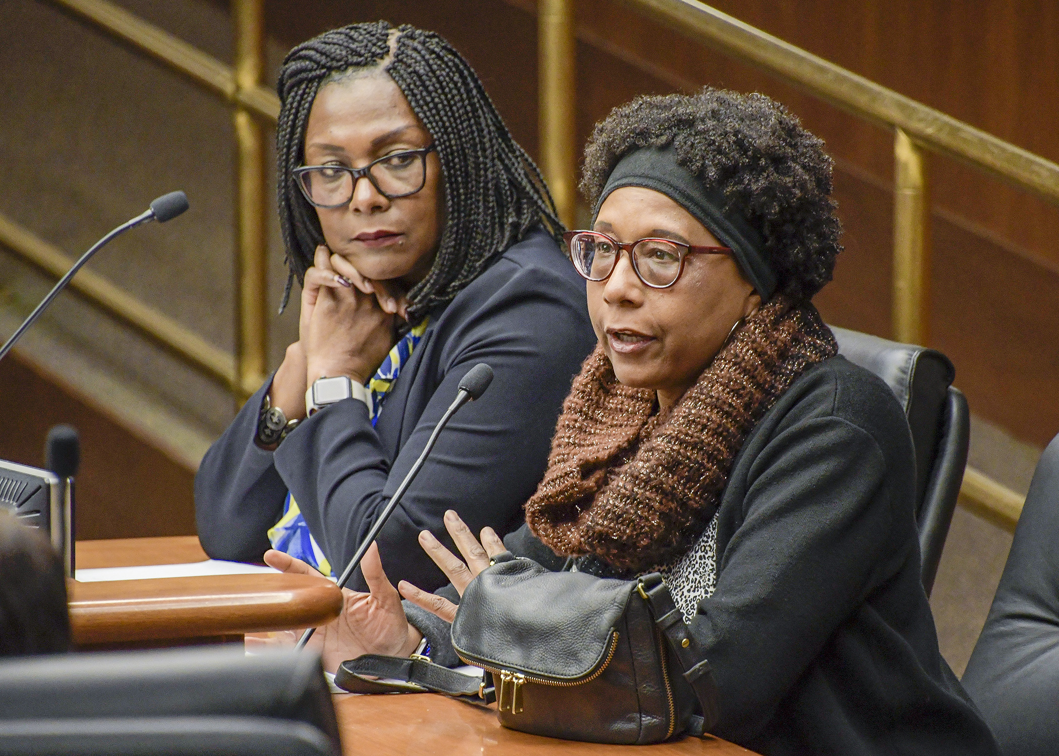 Linda Garrett-Johnson testifies before the House Government Operations Committee in support of a bill sponsored by Rep. Rena Moran, left, that would add a definition of race to the Minnesota Human Rights Act. Photo by Andrew VonBank